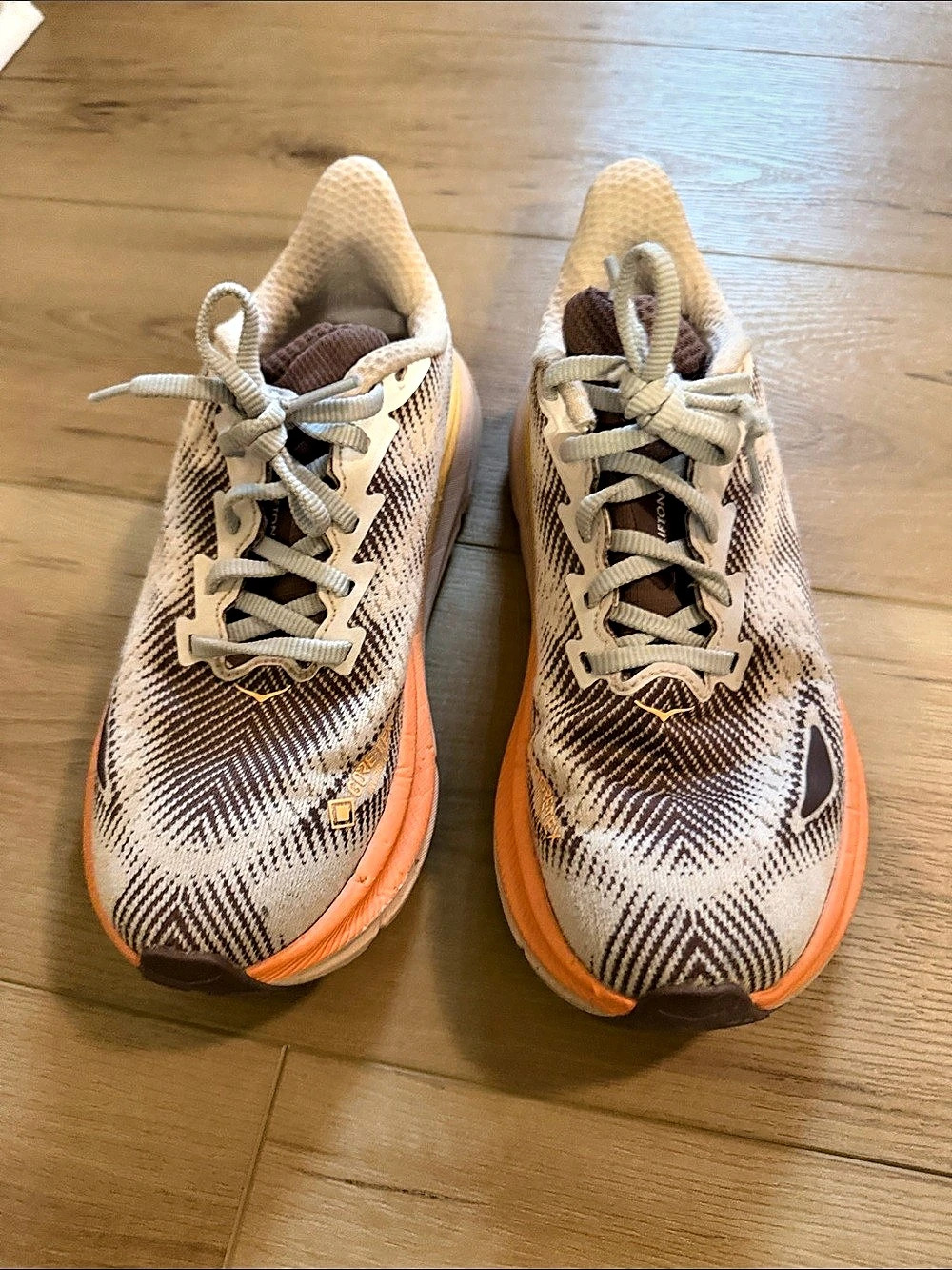 HOKA Clifton 9 Athletic Shoes in White & Orange